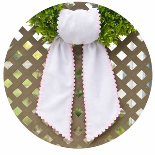 Decorative wreath sash with gingham fabric and scalloped trim close up