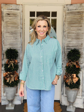 Green and white button-down striped blouse with pocket

Mckenzie striped blouse in green and white vertical stripes

Classic collared blouse with green stripes and long sleeves

Vertical striped button-up blouse with chest pocket