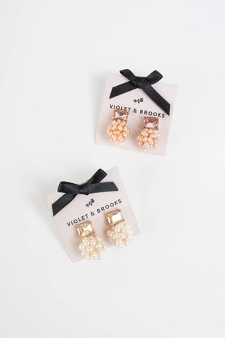 Gold-plated post earrings with rectangular crystal top and cluster of faux pearls

Elegant stud earrings featuring freshwater pearl-inspired cluster and crystal accent

Pearl Cluster Post Earrings in blush and white color options

