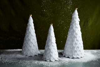White velvet Christmas tree sitters in three sizes

Trio of velvet ribbon loop trees with gold jingle bell toppers

Elegant white velvet holiday tree decor

Velvet Christmas trees with layered ribbon and bell accents

Small, medium, and large velvet tree sitters for holiday display