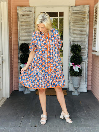 Blue and orange floral scalloped shirt dress with short sleeves and pockets