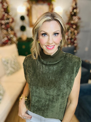 Olive green sleeveless suede top with mock neck

Textured suede sleeveless blouse in dark green

Olive mock neck sleeveless top with soft suede finish