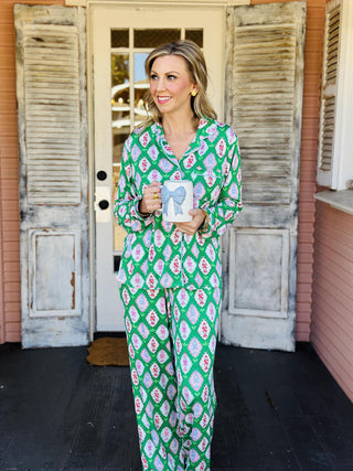 Charlotte Cavalry Christmas Pajama Set with green lattice holiday print

Women’s Christmas pajama set in green, pink, and red Cavalry print

Holiday pajama set with collared button top and drawstring pants

Green festive pajama set with geometric Christmas pattern

Charlotte Cavalry Pajama Set with pockets and classic button top
