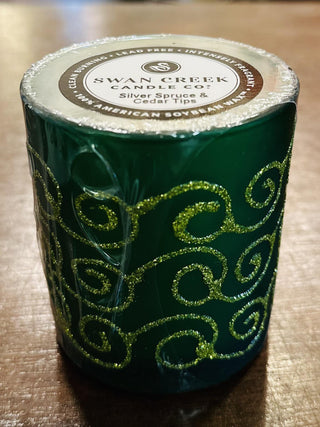 Swan Creek Shimmering Lights Small Vase Candles in assorted colors

Glitter swirl glass candles by Swan Creek in red, green, yellow, and white

Shimmering soy wax candles in colorful glass vases

Small Swan Creek candle collection with decorative swirls

Festive glass vase candles with soy wax by Swan Creek