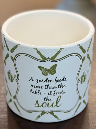 White ceramic garden cachepot with green botanical pattern and inspirational gardening quote, 6-inch decorative planter.