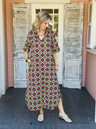 Amber Dress with bold geometric print and short sleeves

Geometric print button-front midi dress with pockets

Colorful patterned midi dress with relaxed fit and collared neckline