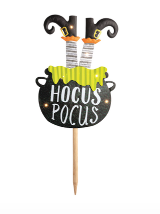 Halloween LED yard stakes featuring a skeleton tombstone, Hocus Pocus cauldron, and ghost carrying a jack-o'-lantern bucket on wooden stakes.