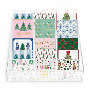 Christmas cocktail napkin collection with assorted holiday designs

Festive holiday napkin assortment featuring trees, bows, and nutcrackers

Set of Christmas-themed cocktail napkins in display stand

Colorful Christmas napkins with traditional and whimsical prints

Holiday napkin set for entertaining, gifting, and parties
