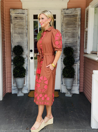 Uncle Frank Thea Dress in brown with vibrant pink embroidery, puff sleeves, collared neckline, pockets, and removable waist belt.