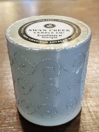 Swan Creek Shimmering Lights Small Vase Candles in assorted colors

Glitter swirl glass candles by Swan Creek in red, green, yellow, and white

Shimmering soy wax candles in colorful glass vases

Small Swan Creek candle collection with decorative swirls

Festive glass vase candles with soy wax by Swan Creek