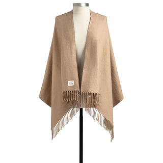Soft camel Giving Wrap with fringe trim displayed on mannequin.

Camel Giving Wrap in gift box with sentiment tag and “Handmade with Love” label.

Cozy camel wrap with fringe from the Giving Collection by Demdaco.