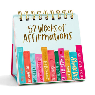 52 Weeks of Affirmations desk flip calendar featuring colorful book-inspired artwork with a new positive affirmation for every week of the year.