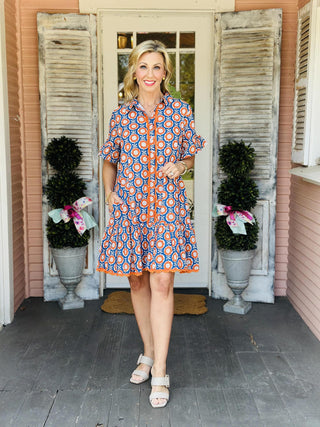 Blue and orange floral scalloped shirt dress with short sleeves and pockets