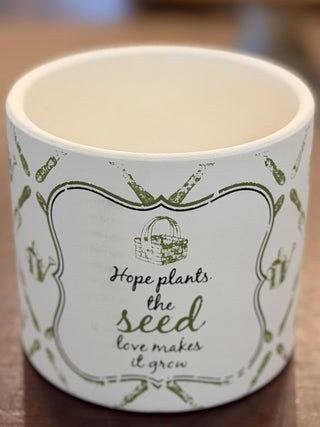 White ceramic garden cachepot with green botanical pattern and inspirational gardening quote, 6-inch decorative planter.