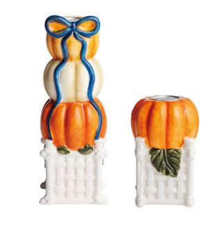 Hand-painted Pumpkin Topiary Taper Holders featuring stacked pumpkins with a blue bow on a white lattice base and coordinating pumpkin taper candle holder.