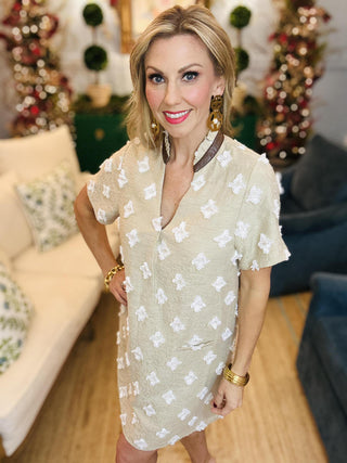 Beige short sleeve dress with textured floral details

Neutral mini dress with white embroidered pattern

Short sleeve beige shift dress with 3D floral accents