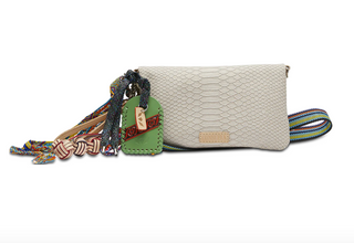 Consuela Thunderbird Uptown Crossbody with embossed snake print exterior and woven strap

Thunderbird Uptown Crossbody by Consuela with leather wristlet strap and charms

Interior view of Consuela Thunderbird Uptown Crossbody showing card slots and zipper compartments

Consuela Thunderbird Uptown Crossbody handbag with snake print and hand-painted bag tag