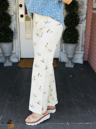 Mallard print stretch denim wide leg jeans with cropped length, front seam detail, and high-rise fit.