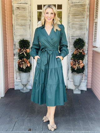 "Laney Dress in sea green with V-neckline, waist tie belt, long sleeves, and tiered hem"

"Sea green midi dress with adjustable waist belt, V-neck, and side pockets – Laney Dress"

"Women’s long sleeve wrap-style dress in sea green with tie waist and pockets"