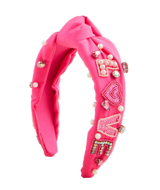 Valentine beaded headband with hearts and rhinestones

Red Valentine headband with hand-beaded heart details

Pink Valentine top-knot headband with rhinestones and beads

White Valentine beaded headband with lip motif

Valentine themed beaded cotton headband with top knot