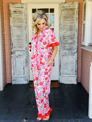 Rose Garden Pajama Pants Set with floral print, ruffle trim, and drawstring waist

Floral button-down pajama pants set with rose garden pattern and ruffled details

Women’s rose print pajama set with collar neckline and ruffle hem pants

Pink floral pajama pants set featuring drawstring waist and feminine ruffle trim