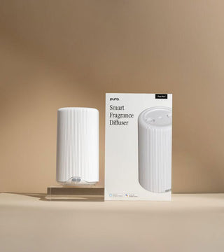 Pura Plus Smart Fragrance Diffuser in white with dual fragrance vial capacity for large rooms.