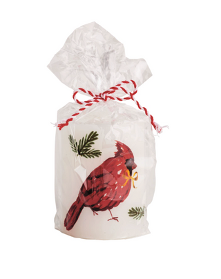 White pillar candle with red cardinal and pine design wrapped in cello

Holiday cardinal pillar candle with festive greenery print

Red bird Christmas candle tied with red and white string

Decorative wax pillar candle with hand-painted cardinal

Cardinal design candle wrapped for gifting