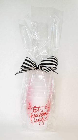 Let Freedom Ring reusable frosted cup with red patriotic script design on a white frosted 16 oz cup.
