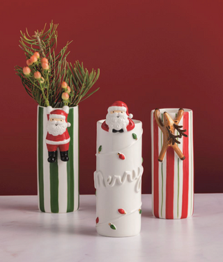 Hand-painted Christmas vases with Santa and reindeer attachments

Holiday striped vases with hanging Santa and reindeer designs

Ceramic Christmas vases with festive hand-painted details

Holiday stoneware vases in red and green stripes with Santa accents

Decorative Christmas vases for seasonal florals and greenery