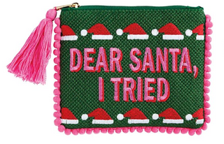 Holiday Pom Cases featuring needlepoint embroidered holiday sayings, colorful pom trim, tassel zipper pulls, and fully lined cotton interiors.