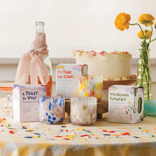 Celebration candles in colorful hand blown glass with gift boxes