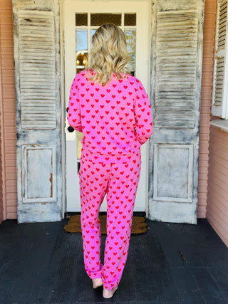 Pink heart print jogger set with long sleeve top and elastic waist pants

Women’s pink heart lounge set with cozy sweatshirt and jogger pants

Valentine heart print pajama jogger set in soft pink fabric

Pink heart matching lounge set with relaxed fit joggers

Cozy pink heart jogger pajama set for women