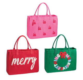 Holiday Bouclé Totes featuring festive canvas designs with bouclé yarn sentiments including "Merry," "Fa La La," and "Merry Christmas" wreath.