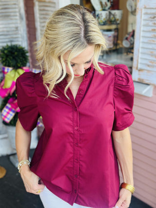 Burgundy puff sleeve blouse with ruffled collar and button-down front