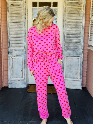 Pink heart print jogger set with long sleeve top and elastic waist pants

Women’s pink heart lounge set with cozy sweatshirt and jogger pants

Valentine heart print pajama jogger set in soft pink fabric

Pink heart matching lounge set with relaxed fit joggers

Cozy pink heart jogger pajama set for women