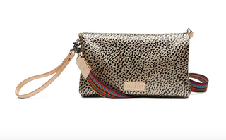 Consuela Wesley Uptown Crossbody with pebbled exterior, wristlet strap, and adjustable crossbody strap

Interior view of Consuela Wesley Uptown Crossbody showing card slots, ID window, and zip compartments

Wesley Uptown Crossbody by Consuela with dual magnetic closure and organized wallet interior