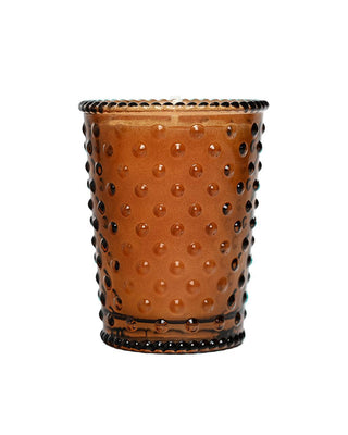 Chestnut Votive Hobnail Glass Candle in amber glass jar

Fall-scented soy candle with chestnut and vanilla fragrance

Hand-poured Chestnut candle in textured hobnail glass

Warm roasted chestnut candle in amber hobnail holder

3.5 oz Chestnut Votive Candle with brown sugared pecan scent