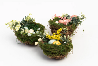 Easter nest with pastel eggs and faux spring flowers

Decorative Easter nest with moss, faux florals, and speckled eggs

Spring Easter nest décor with greenery and pastel eggs

Faux floral Easter nest centerpiece with decorative eggs