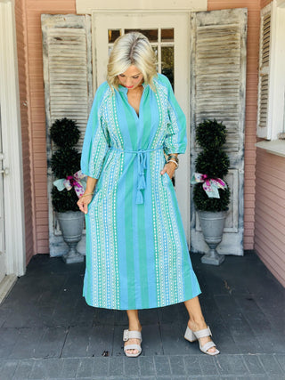 Women’s Molly Dress patterned maxi dress featuring split neckline, three-quarter sleeves, and tassel belt