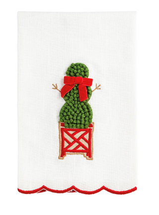White cotton slub hand towel featuring a French knot embroidered snowman topiary in a red planter with a velvet bow and embroidered scalloped red hem.
