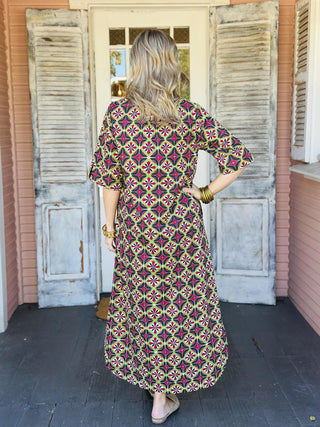 Amber Dress with bold geometric print and short sleeves

Geometric print button-front midi dress with pockets

Colorful patterned midi dress with relaxed fit and collared neckline