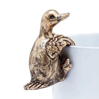 Decorative Duck Pot Hanger with an antique gold finish, designed to perch on the edge of a planter or flower pot.