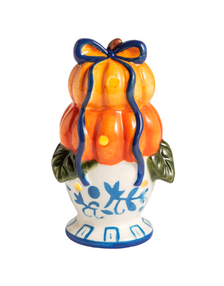 Hand-painted ceramic Pumpkin Topiary Light-Up Sitter with stacked orange pumpkins, blue bow, LED lights, and blue chinoiserie-inspired pedestal base.