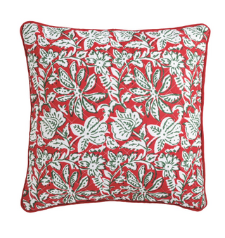Double-sided quilted block print pillow featuring a red floral pattern on one side and a green geometric floral pattern on the reverse with red piped edging.