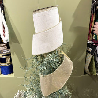 White velvet ribbon with metallic gold dupion backing and gold edge detail, 4-inch decorative ribbon spool.