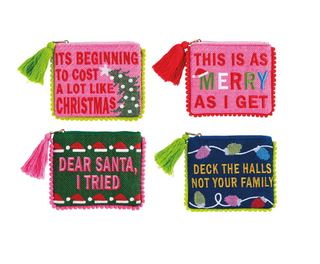 Holiday Pom Cases featuring needlepoint embroidered holiday sayings, colorful pom trim, tassel zipper pulls, and fully lined cotton interiors.