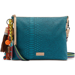 “Consuela Indy Downtown Crossbody in turquoise reptile texture with charms”

“Indy Consuela crossbody with turquoise snake-print exterior and woven strap”

“Turquoise Consuela crossbody bag with adjustable strap and zipper closure”

“Consuela Indy bag with handcrafted Jody charm and leather trim”

“Interior of Consuela Indy Downtown Crossbody showing pockets and card slots”