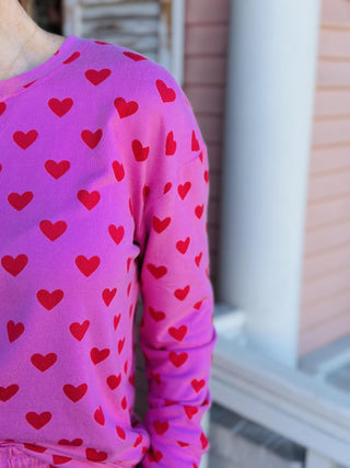 Pink heart print jogger set with long sleeve top and elastic waist pants

Women’s pink heart lounge set with cozy sweatshirt and jogger pants

Valentine heart print pajama jogger set in soft pink fabric

Pink heart matching lounge set with relaxed fit joggers

Cozy pink heart jogger pajama set for women