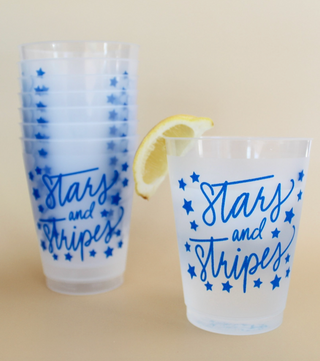 Stars & Stripes frosted acrylic cup with blue patriotic script and star design on a reusable 16 oz cup.