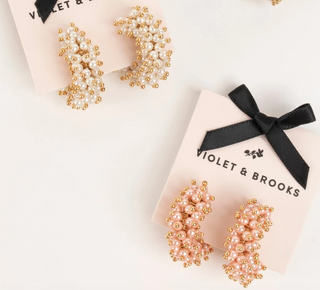 Mini gold-plated hoop earrings with blush faux pearls and gold bead accents

Small Talulah hoop earrings in white faux pearls with gold-plated brass

Mini statement hoop earrings with clustered faux pearls and gold detailing